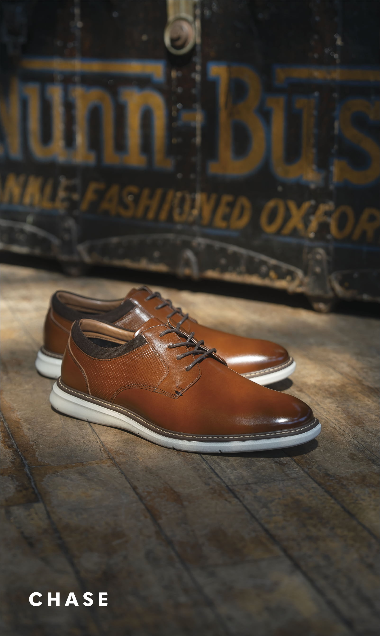 Men's Casual Shoes category. Image features the Chase Plain Toe Oxford in cognac. 