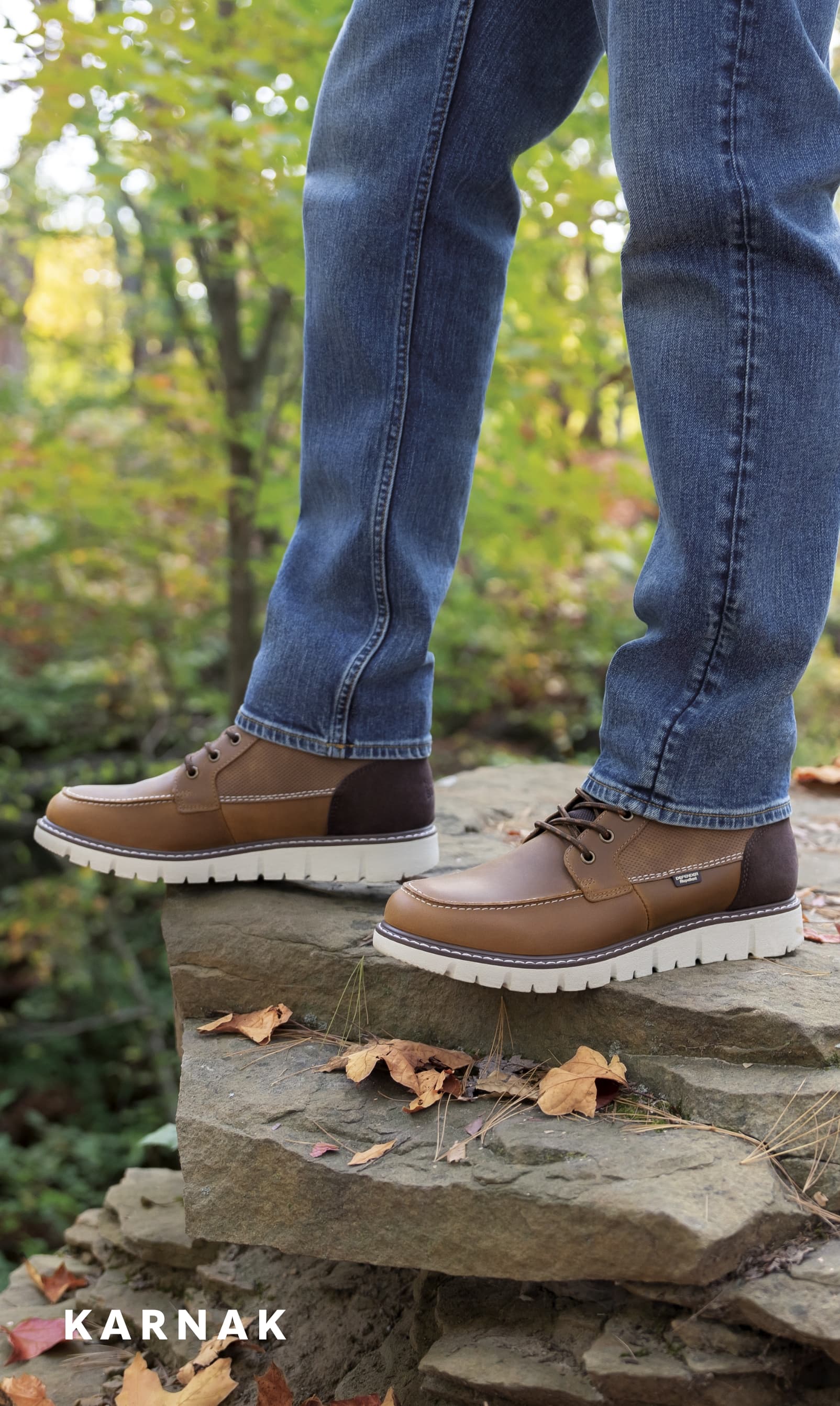 Men's Boots category. Image features the Karnak Moc Toe Boot in tan. 